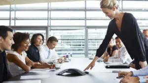 Business meeting using speaker phone in conference Business meeting using speaker phone in conference